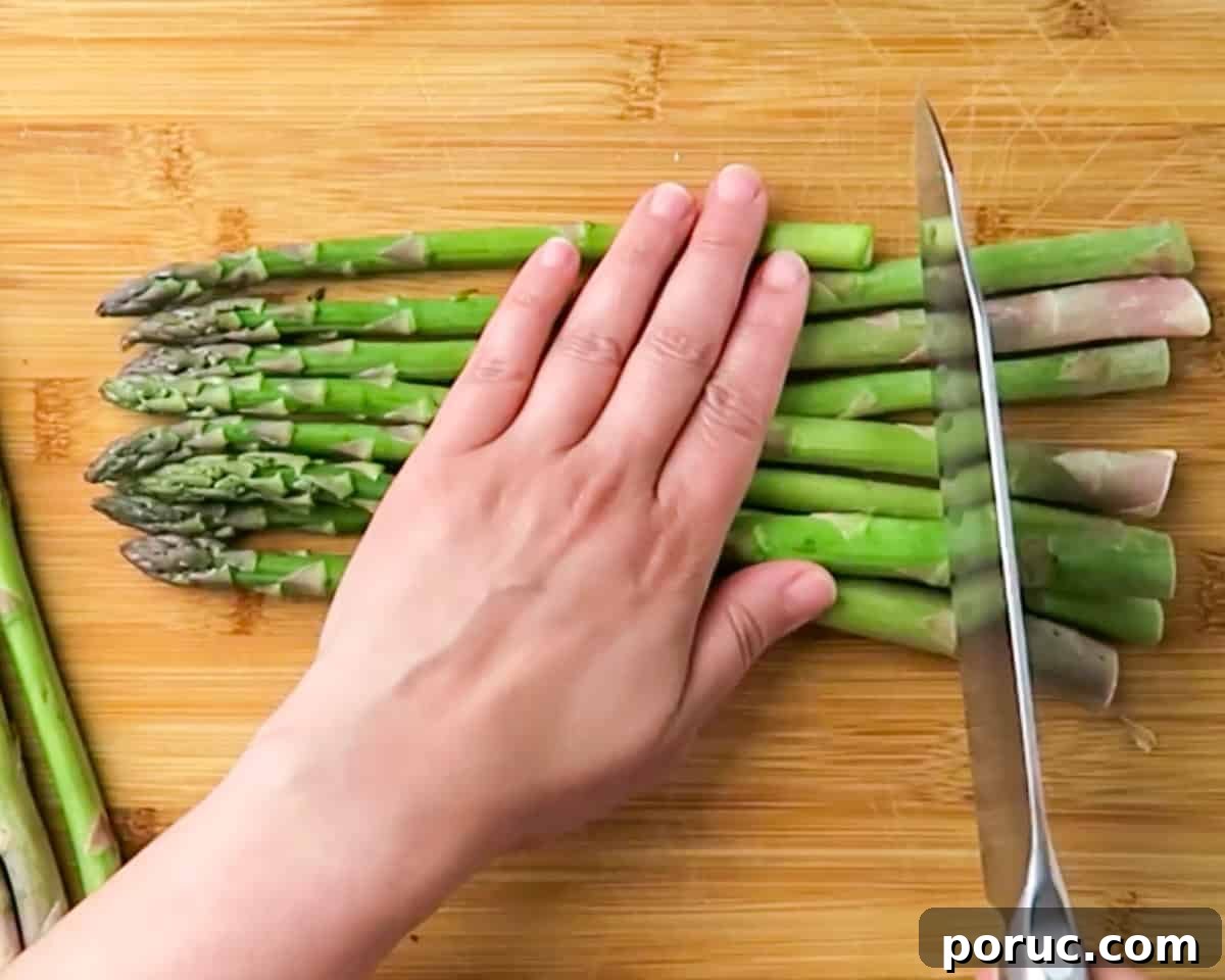 trimming the ends of fresh asparagus
