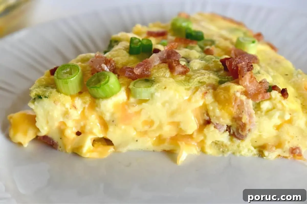 Crustless Cottage Cheese Quiche Recipe: Light Protein-Packed Bake 6 Cottage Cheese Quiche on a white plate topped with bacon and green onions.