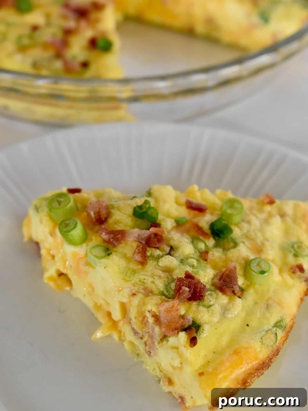 Crustless Cottage Cheese Quiche Recipe: Light Protein-Packed Bake 7 Slice of cottage cheese quiche on a white plate.