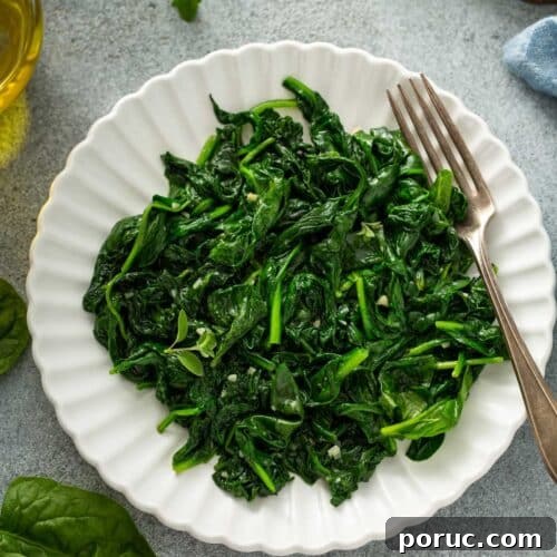 Sauté spinach on a white bowl