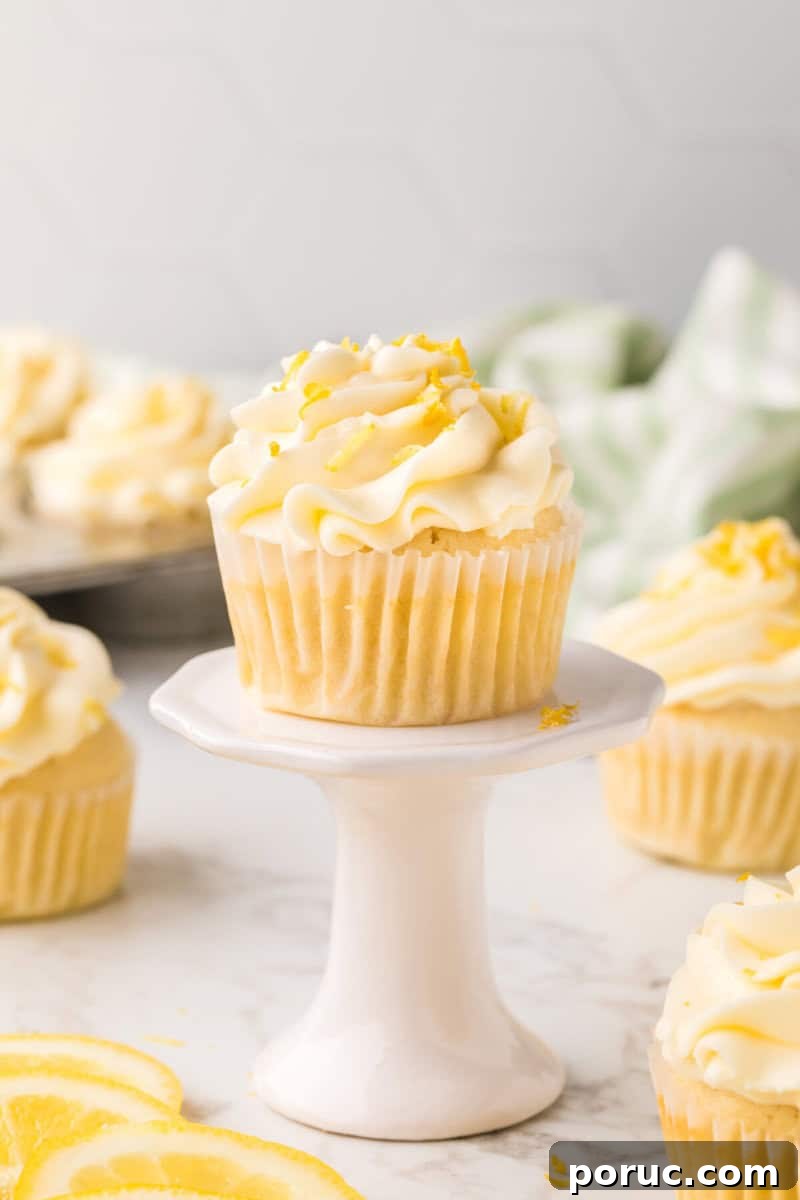 Zesty Lemon Cupcakes Recipe with Simple Glaze 11 Lemon Cupcakes on a single white stand.
