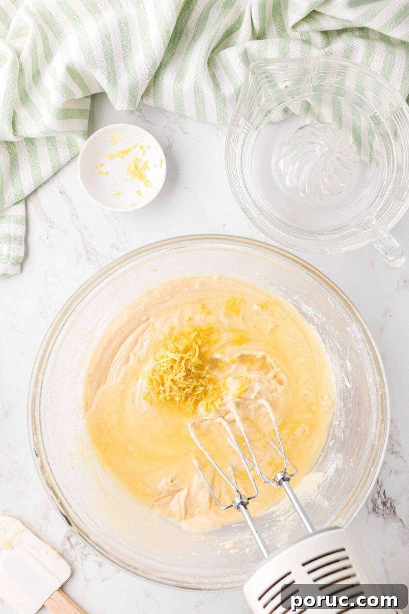 Zesty Lemon Cupcakes Recipe with Simple Glaze 6 adding the lemon juice and lemon zest to the wet ingredients.