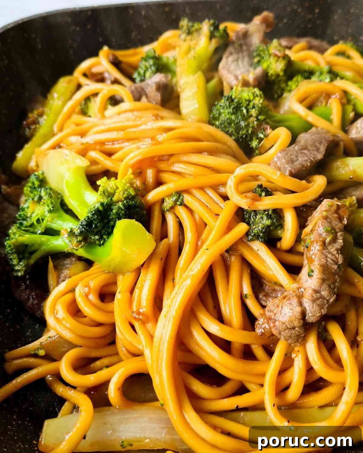 Beef and Broccoli Noodles with Garlic Soy Sauce Recipe 11 Close up of noodle stir fry steaming from the frying pan