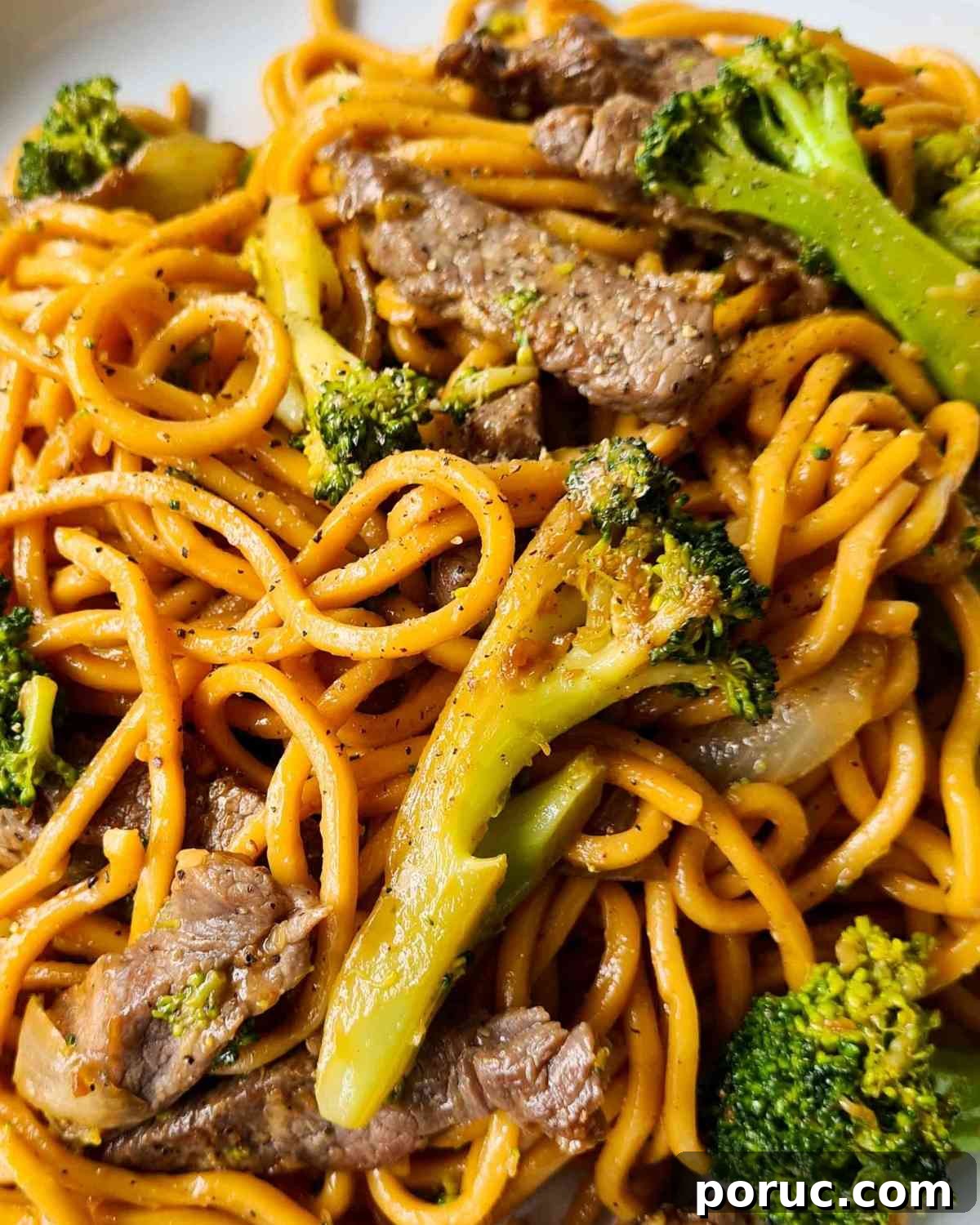 Beef and Broccoli Noodles with Garlic Soy Sauce Recipe 13 Close up of noodles, broccoli, beef strips and black pepper