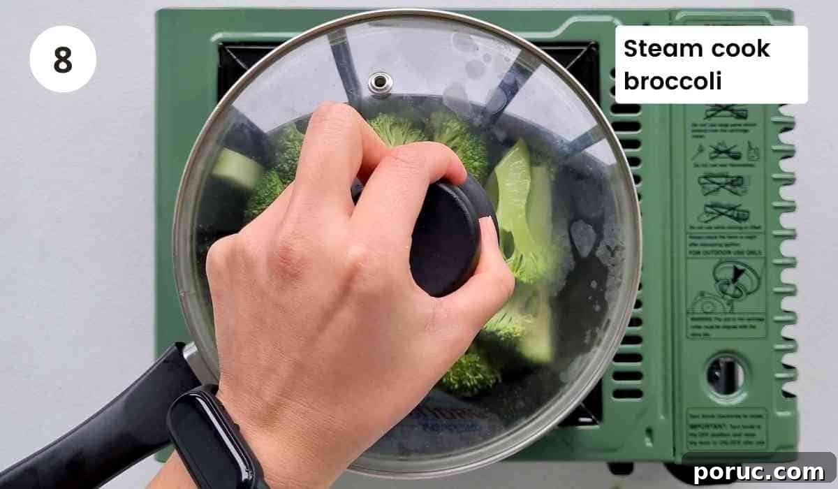 Beef and Broccoli Noodles with Garlic Soy Sauce Recipe 8 cooking broccoli in a saucepan with caption