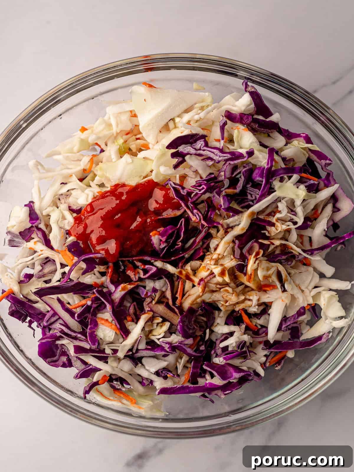Korean BBQ Beef Tacos with Spicy Gochujang Slaw 6 Slaw mix in a bowl with sauce ingredients.