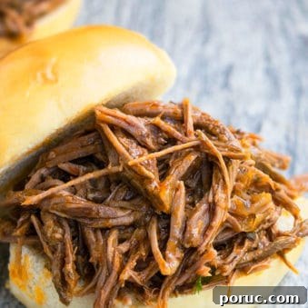 Easy One Pot BBQ Shredded Beef in Burger Buns.