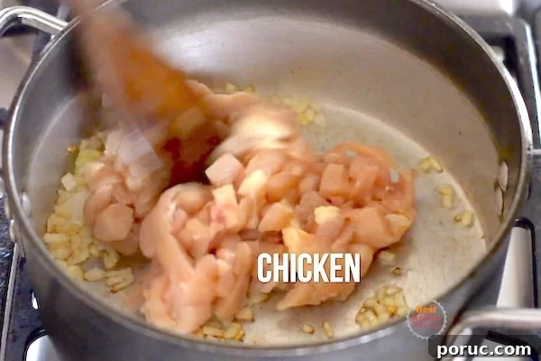 Chicken added to pot