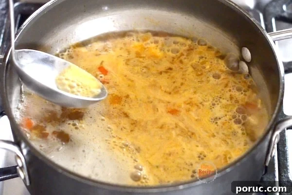 Skimming the simmering soup