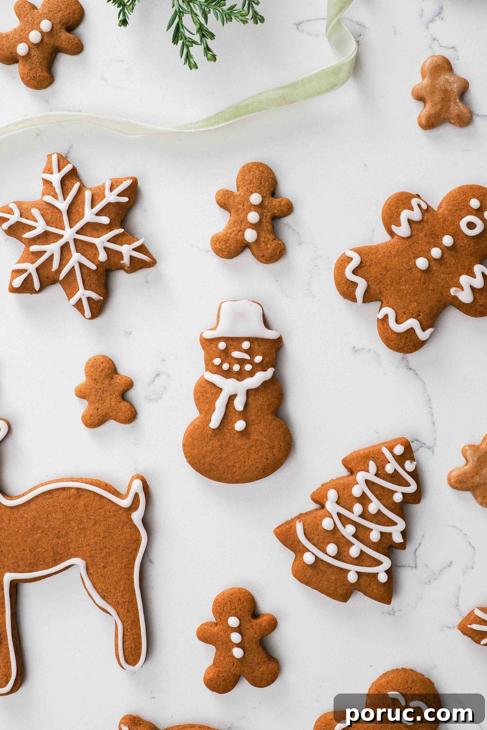 Classic Gingerbread Cookies Recipe for Crisp, Spiced Treats 17 A gingerbread snowman amongst other gingerbread cookies.
