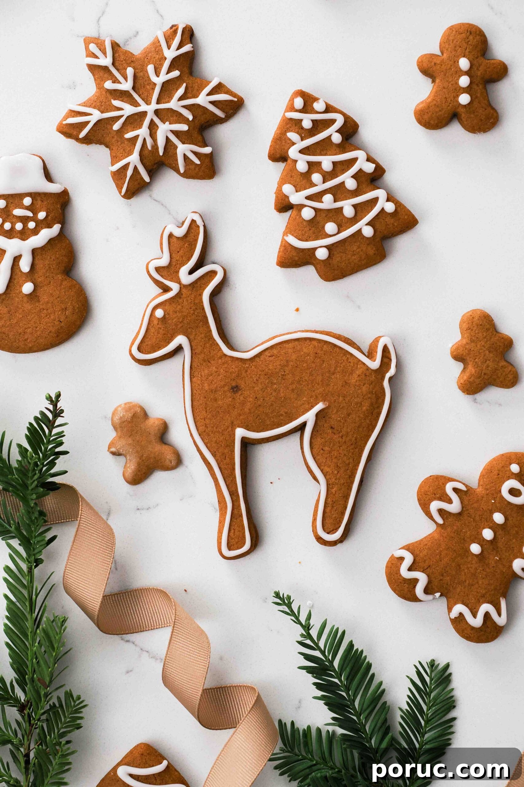 Classic Gingerbread Cookies Recipe for Crisp, Spiced Treats 19 A gingerbread reindeer amongst other gingerbread cookies.