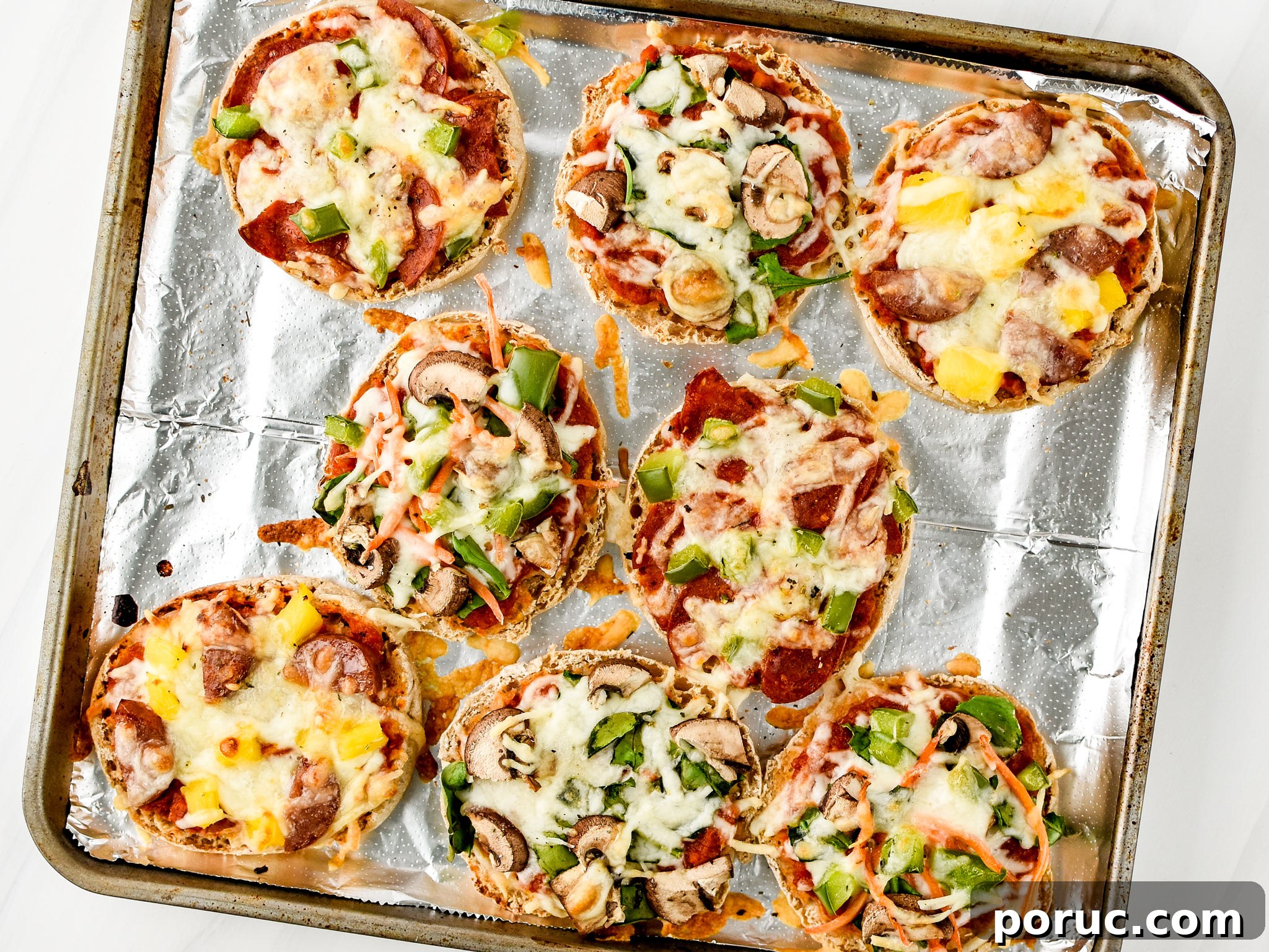 Mini English Muffin Pizzas for Weekly Meal Prep 6 English muffin mini pizzas fresh from the oven - four ways!