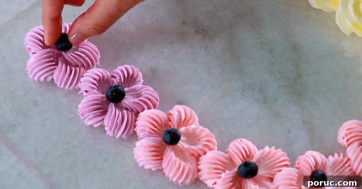 blueberries on buttercream flowers