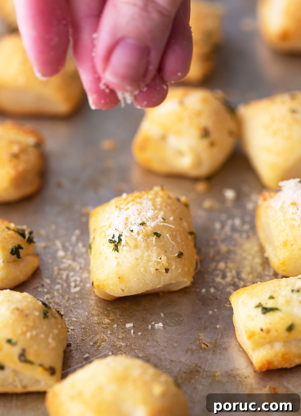 Sprinkling Parmesan on Bread Bites