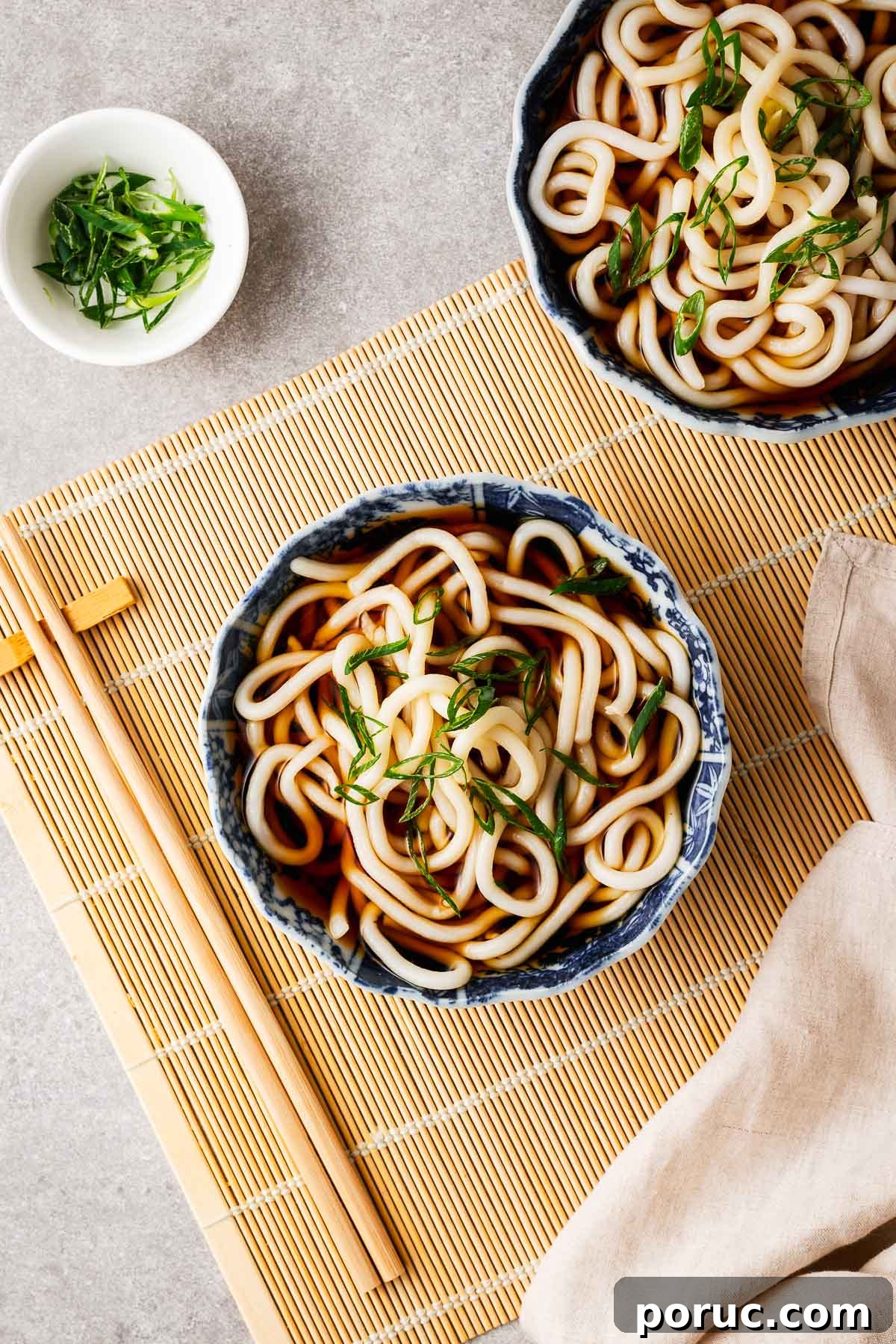 Kake Udon: Classic Japanese Broth Noodle Soup Recipe 11 Kake udon in Japanese ceramic bowls topped simply with sliced green onions.