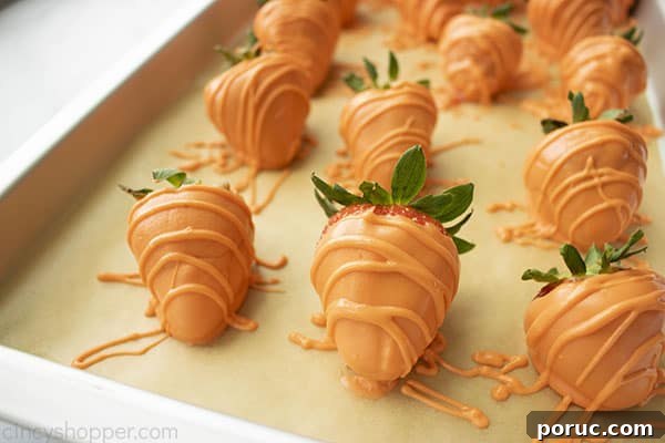 Orange Easter Chocolate Covered Strawberries on a pan