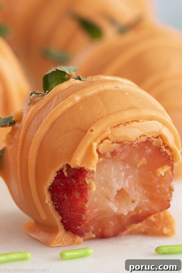 Orange Chocolate Dipped Strawberries with bite.