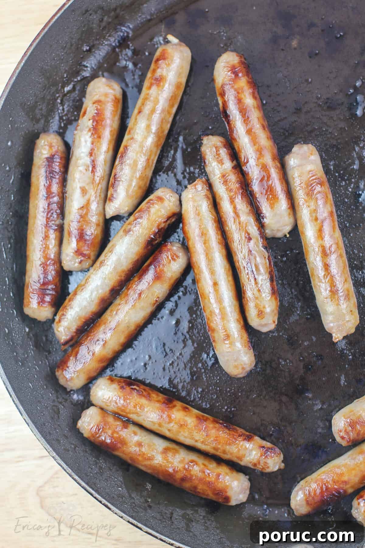 Cinnamon Roll Pig in a Blanket Bites: Sweet Savory Appetizer 4 cooked sausage links in skillet