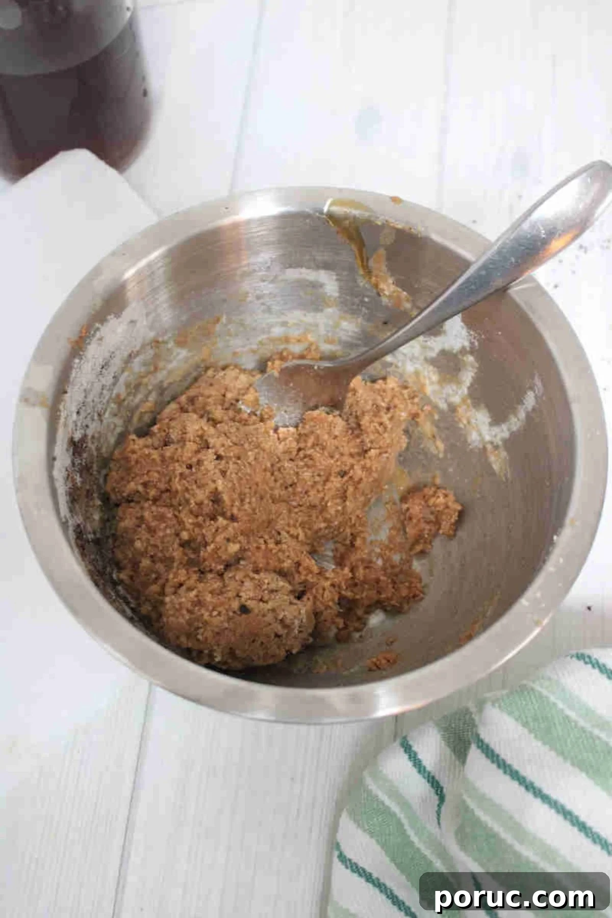 Gluten-Free Coffee Protein Bites: Energy Snacks for Busy Mornings 5 Steel bowl with raw batter for coffee protein balls.