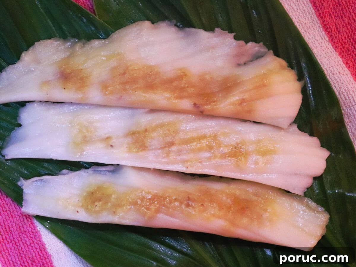 Konkani Patoleo (Patoli) Recipe: Steamed Rice Leaves Dessert 2 close-up of patoli. It shows 3 patoli placed on a banana leaf.