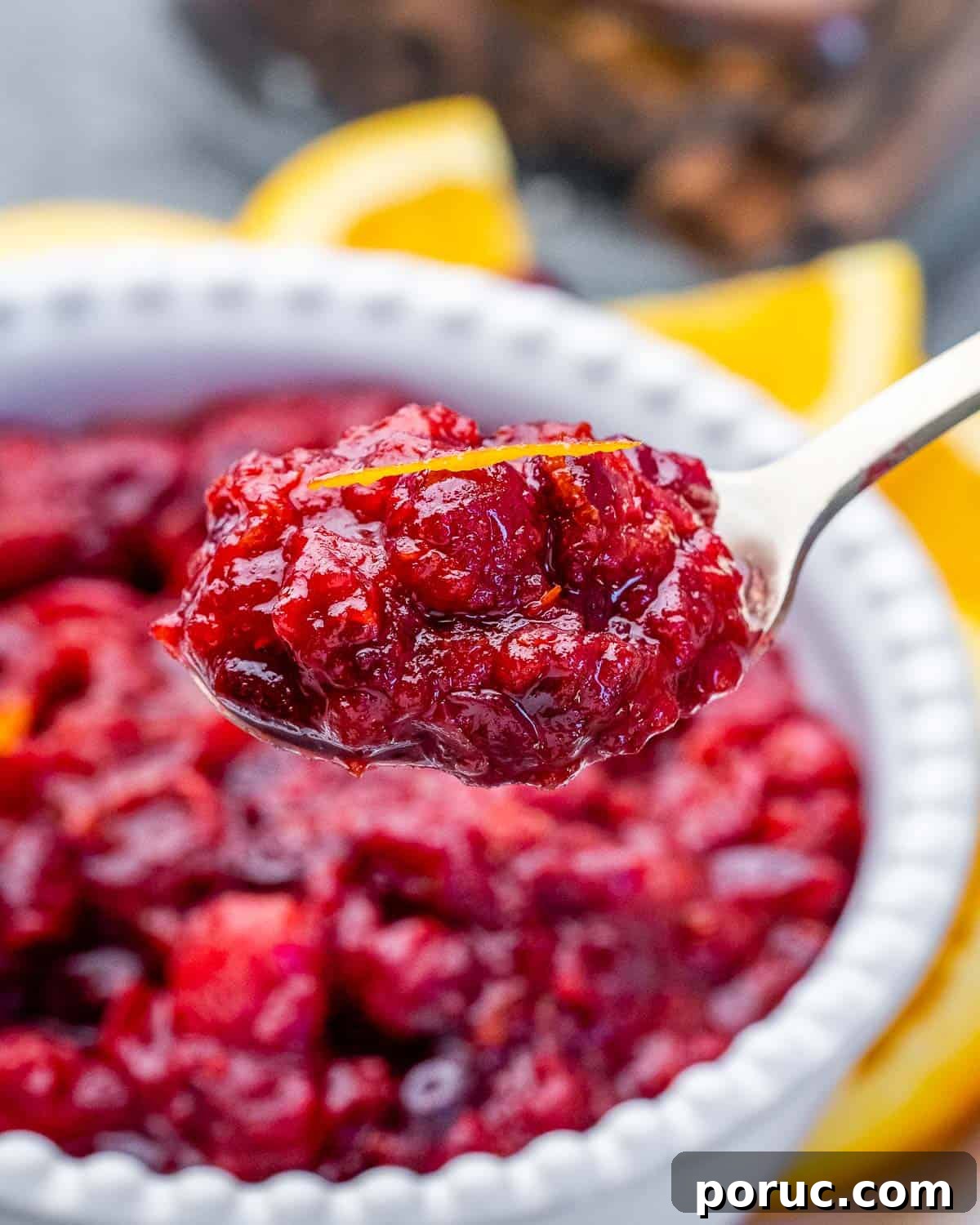 Tangy Cranberry Orange Sauce Recipe for Holidays and Leftovers 8 Spoonful of homemade cranberry sauce.