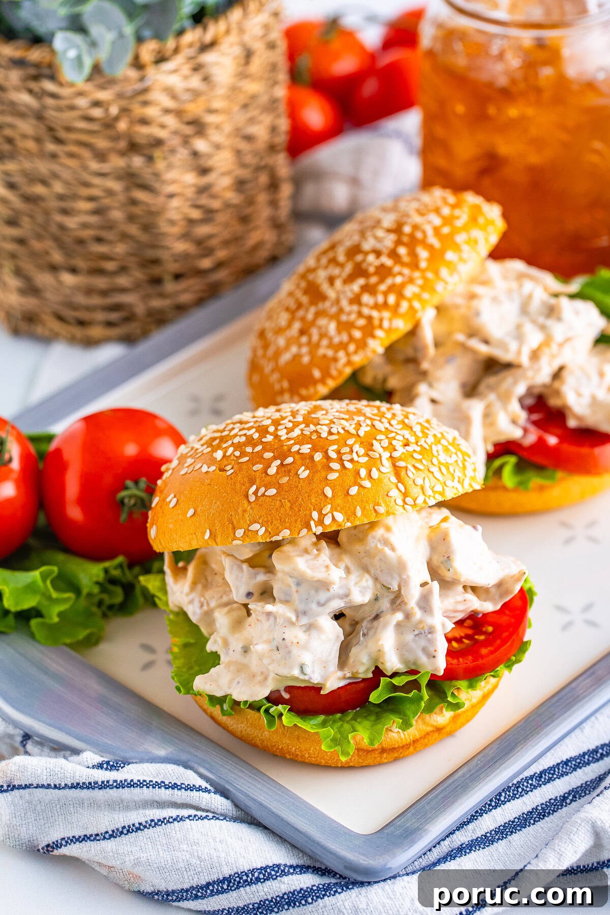 Quick Rotisserie Chicken Salad with Creamy Lemon Dijon Dressing 6 farther away image of Rotisserie Chicken Salad served on sandwiches