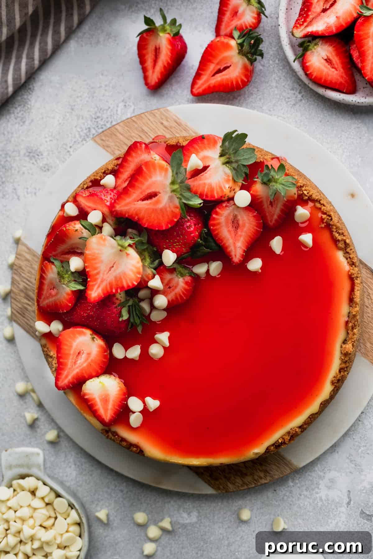 Strawberry white chocolate cheesecake with strawberries on top.