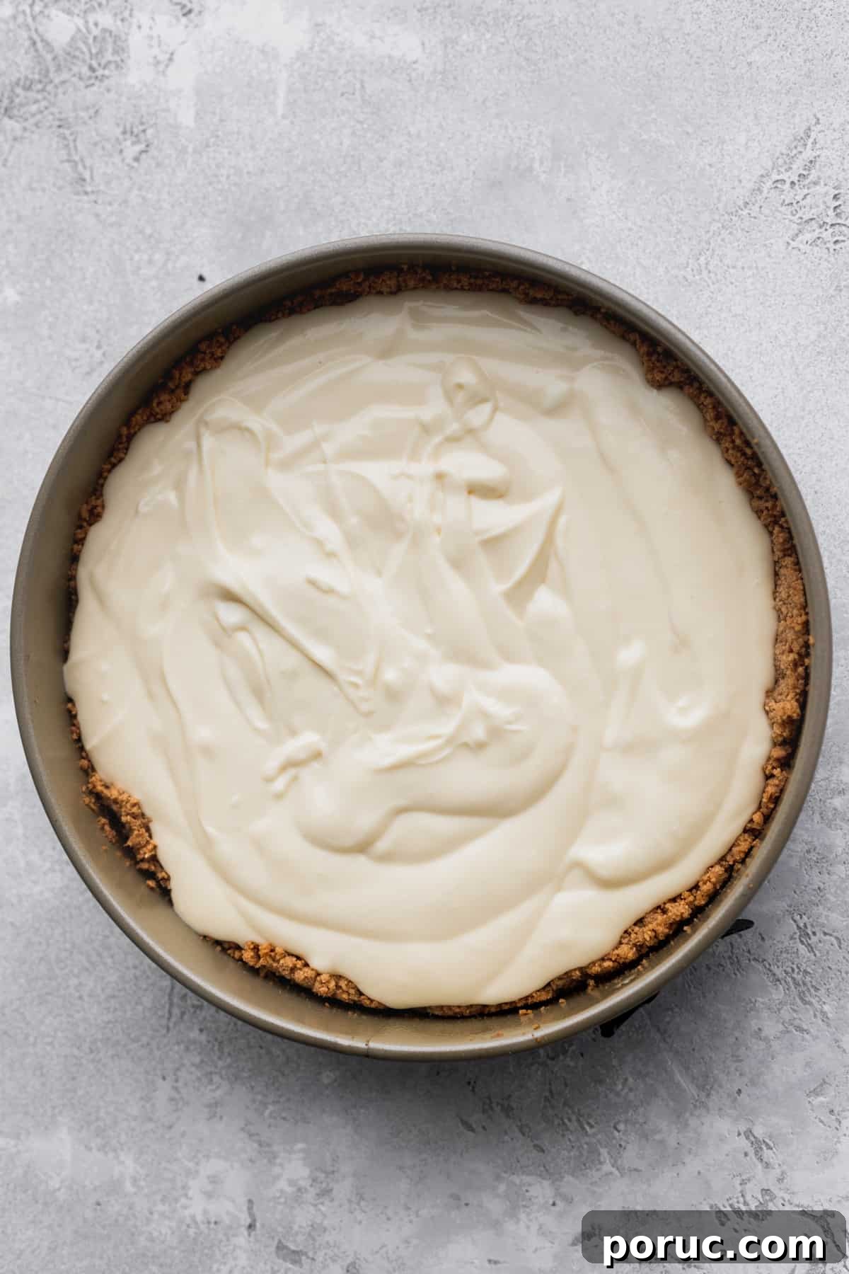 Cheesecake batter in a springform pan.