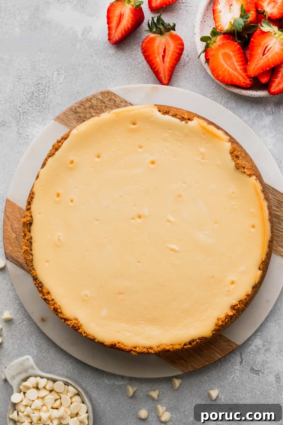 Baked cheesecake on a board.