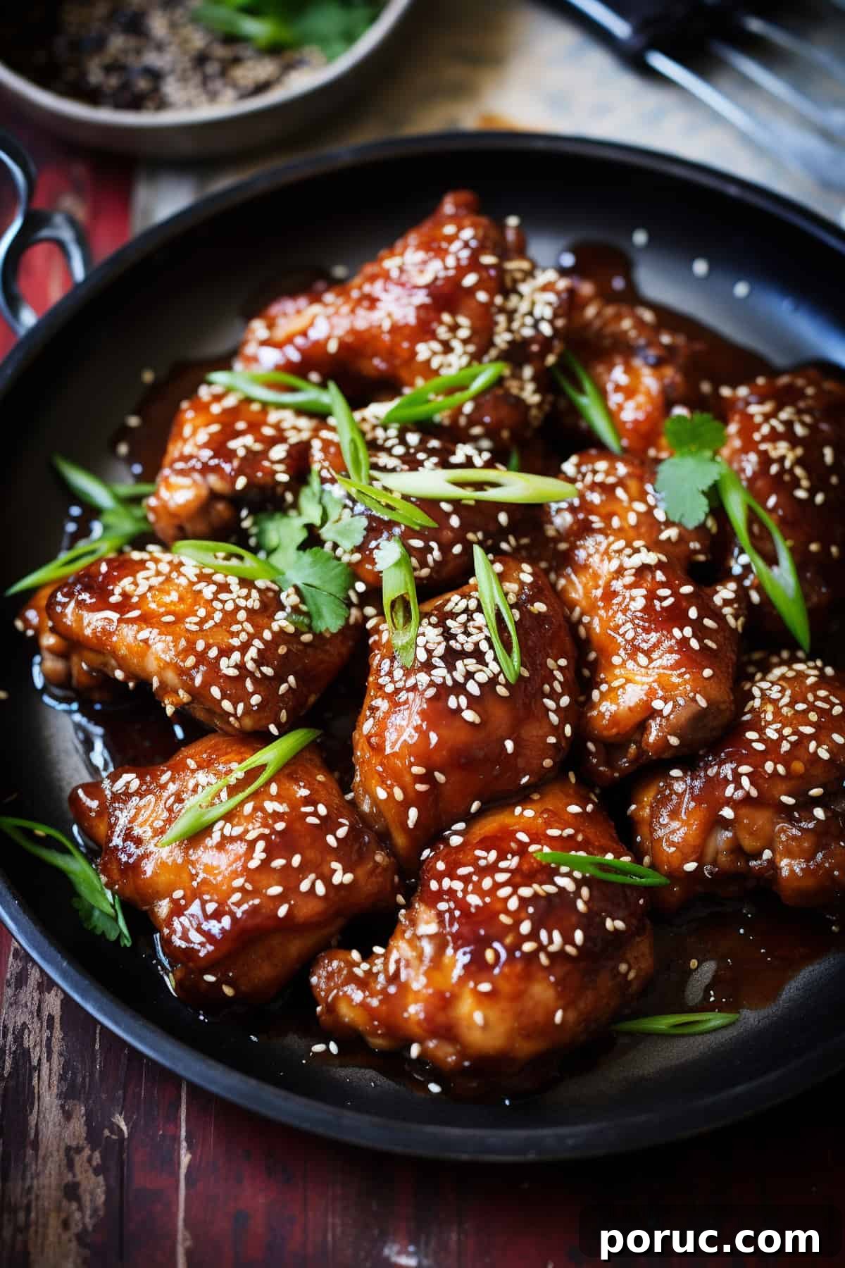 Asian-Style Baked Honey Chicken Recipe 2 Baked honey sesame chicken in a skillet.