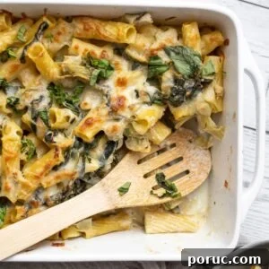 Spinach and Artichoke Pasta Bake with 7 Simple Ingredients 17 artichoke spinach baked pasta in a white baking dish