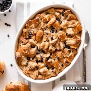bread pudding with dried blueberries in oval casserole dish