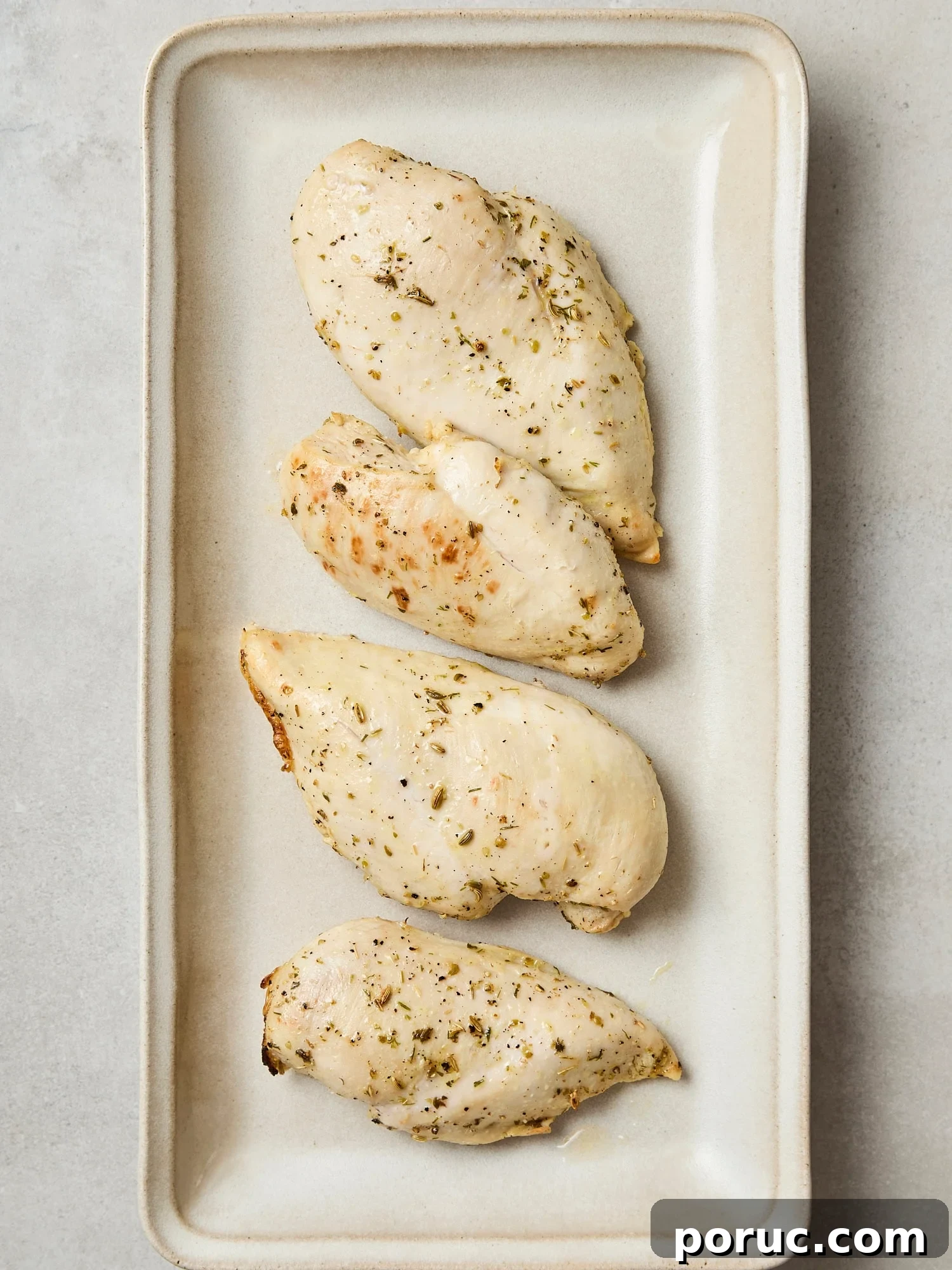 Baked chicken breast after coming out of the oven.