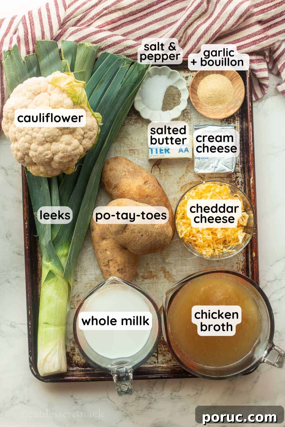 Creamy Potato, Leek & Cauliflower Soup Recipe 3 Labeled ingredients for potato leek cauliflower soup in bowls on baking sheet.