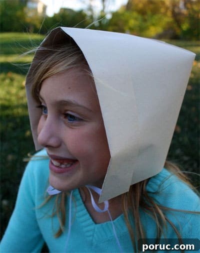 girl wearing pilgrim bonnet