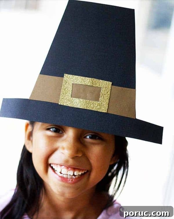 child wearing diy made pilgrim hat