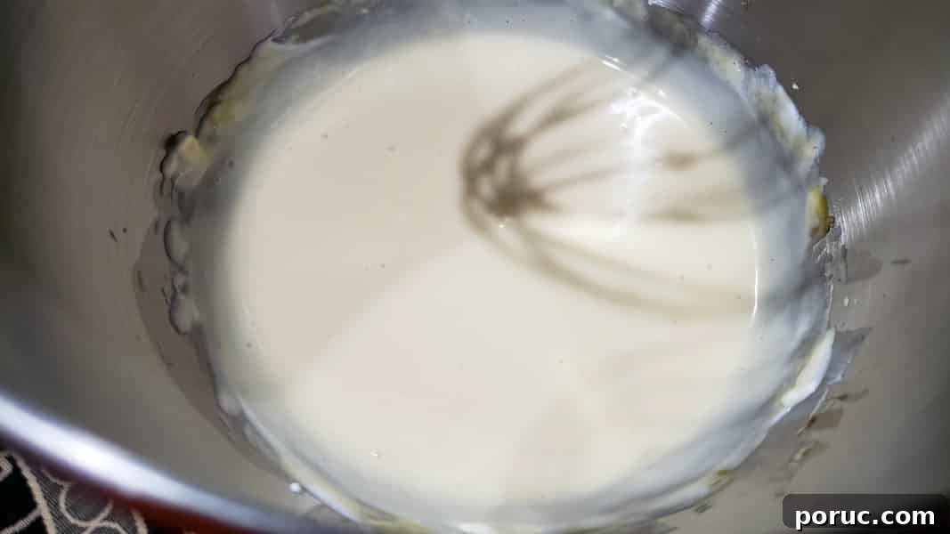 Lemon Blueberry Cheesecake Recipe: Creamy No-Bake Dessert 6 cheesecake filling mixed in a stand mixer bowl.