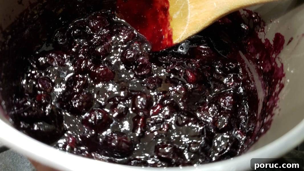 Lemon Blueberry Cheesecake Recipe: Creamy No-Bake Dessert 3 blueberry sauce for cheesecake cooking in a pan.